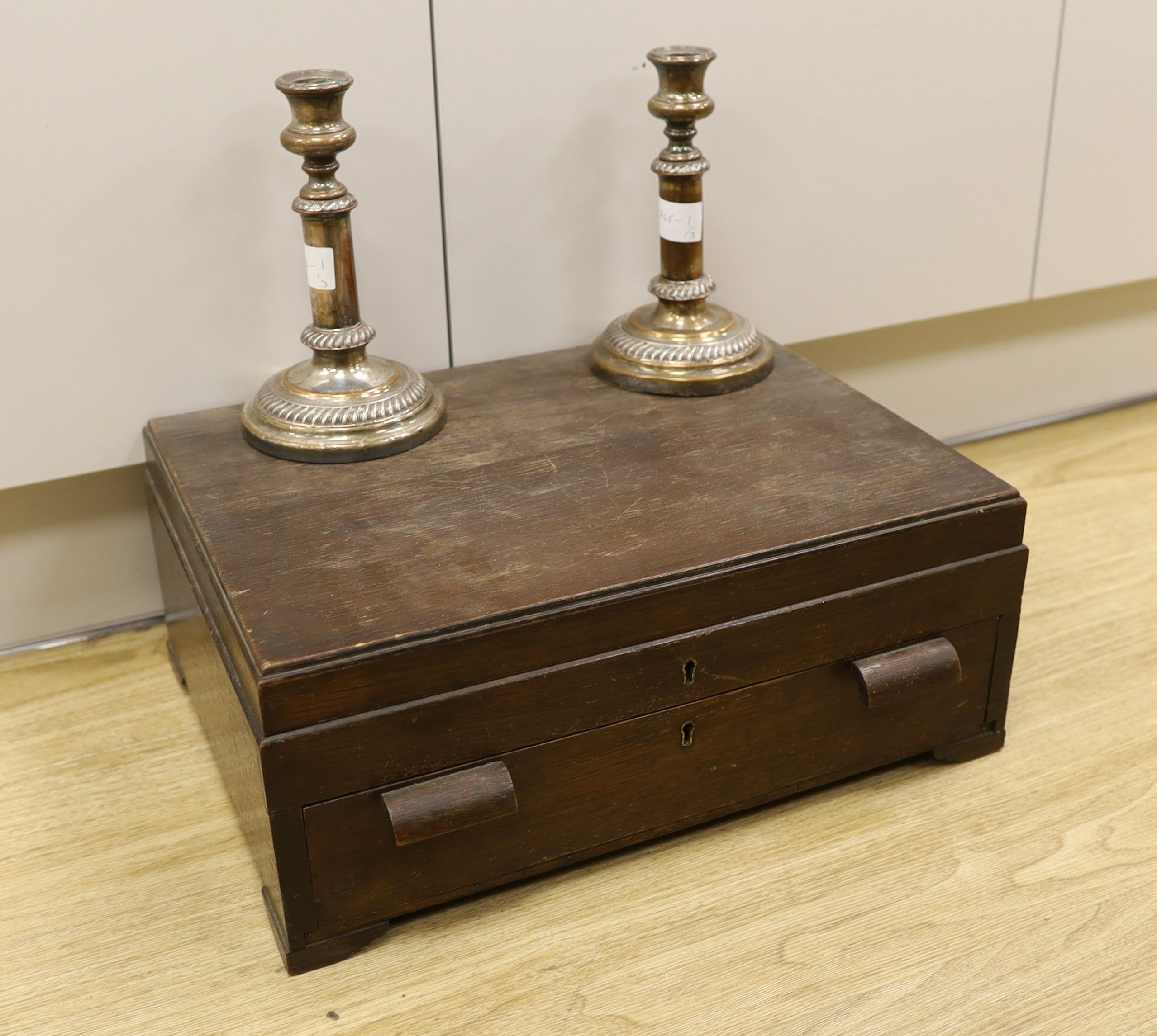 A pair of plated telescopic candlesticks and a Mappin & Webb part canteen of plated cutlery